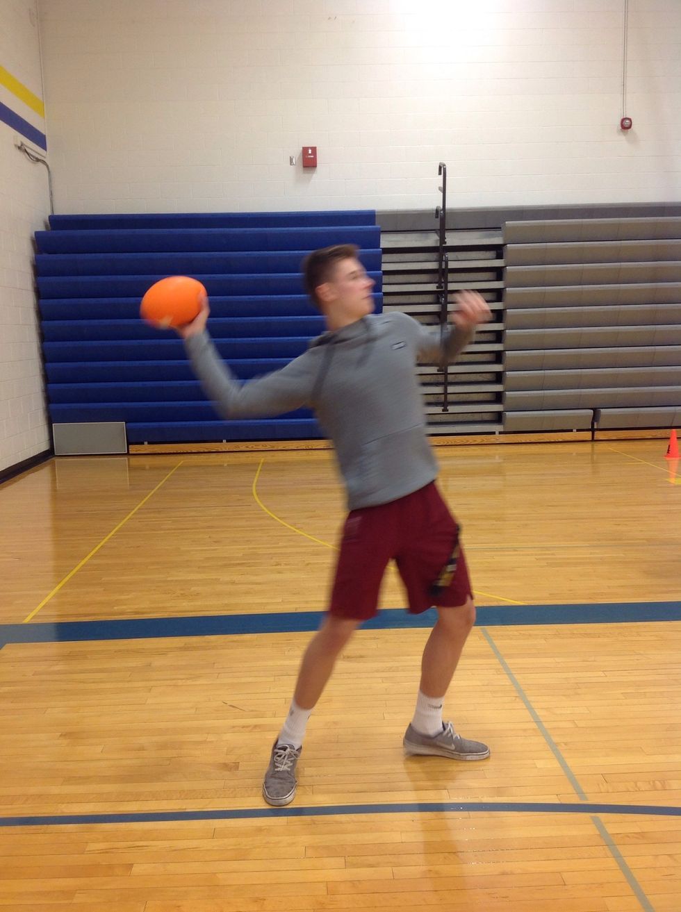 When you have brought your arm fully back begin to rapidly throw your arm forward toward your target