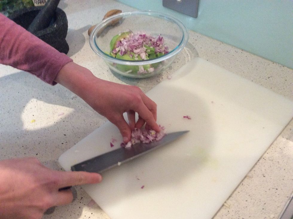 When you have cut it finer scoop it onto your knife and place it into the bowl. Do this for everything.