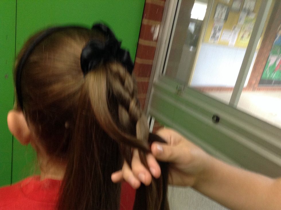 When you have joined the part to your plait start plaiting down again.