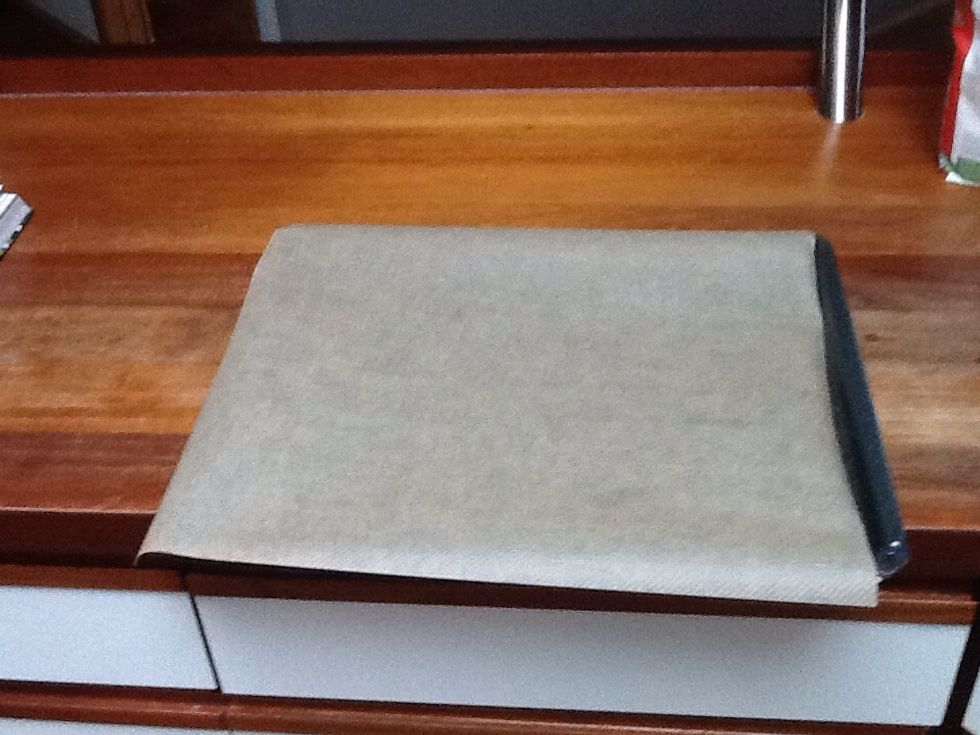 When you have made the dough you take a plate and place a parchment paper on it.