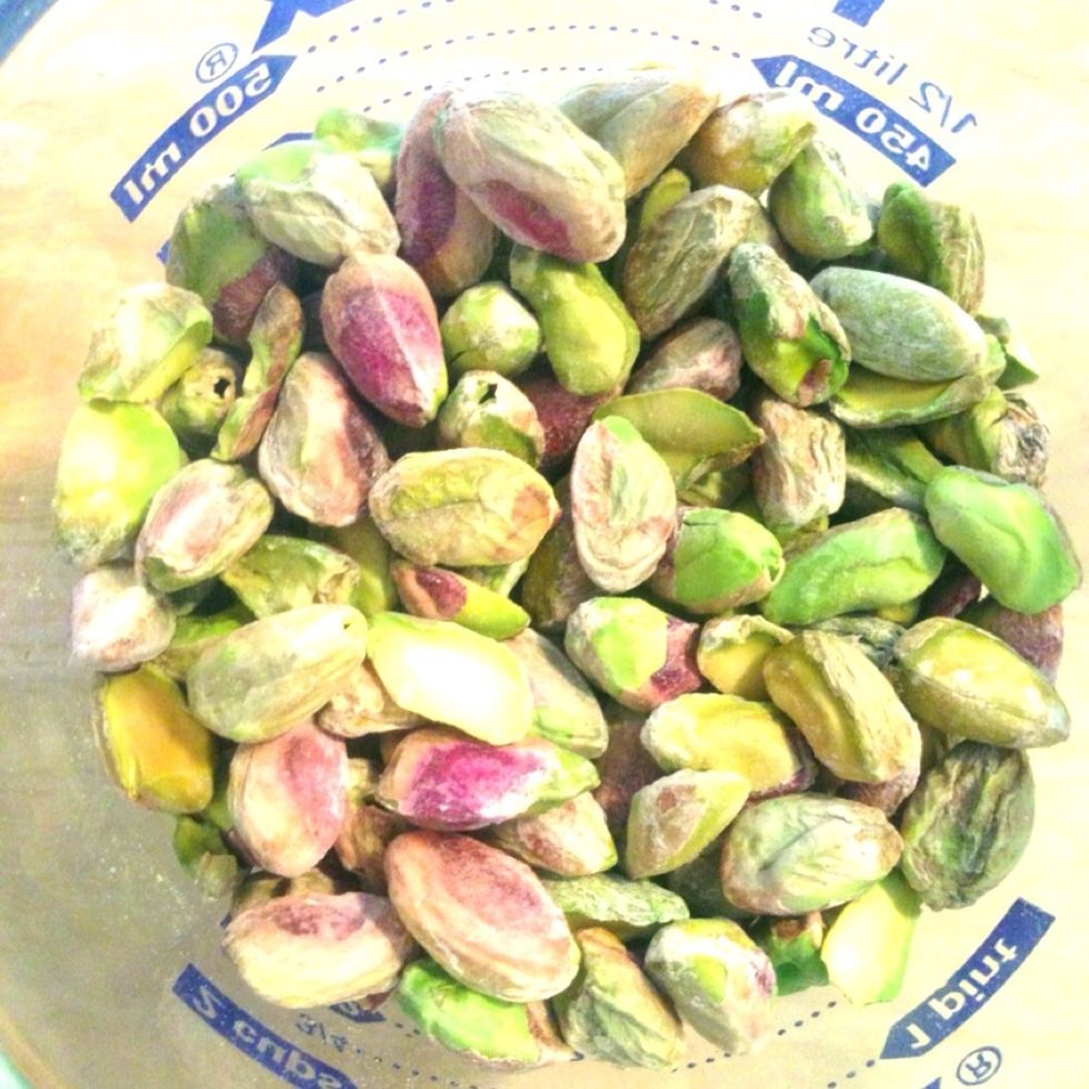 When you have some free time, perhaps while watching TV, remove shells and as much of the skin as you can from the pistachios.