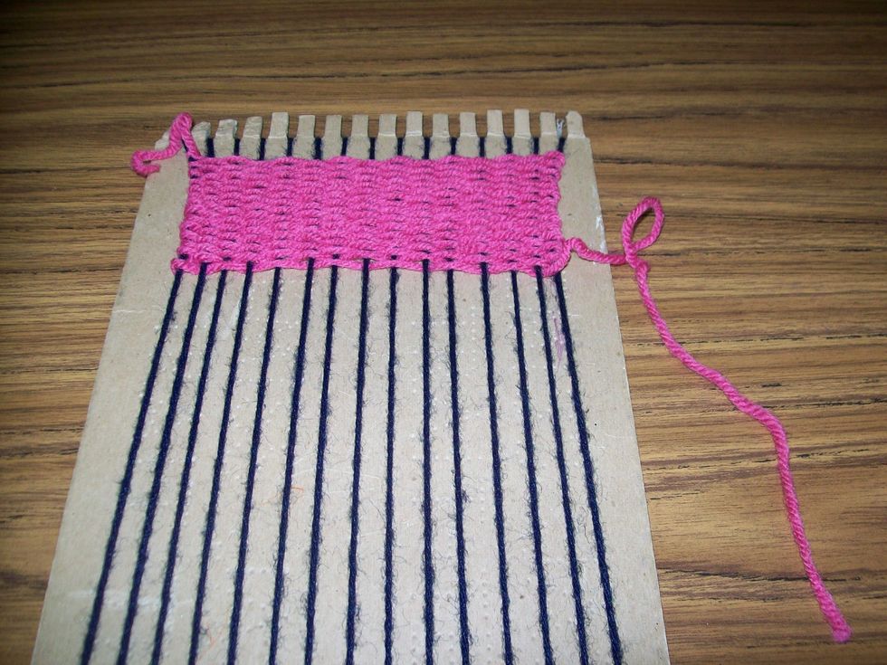 When you have woven your desired amount you may take the needle off of the weft.