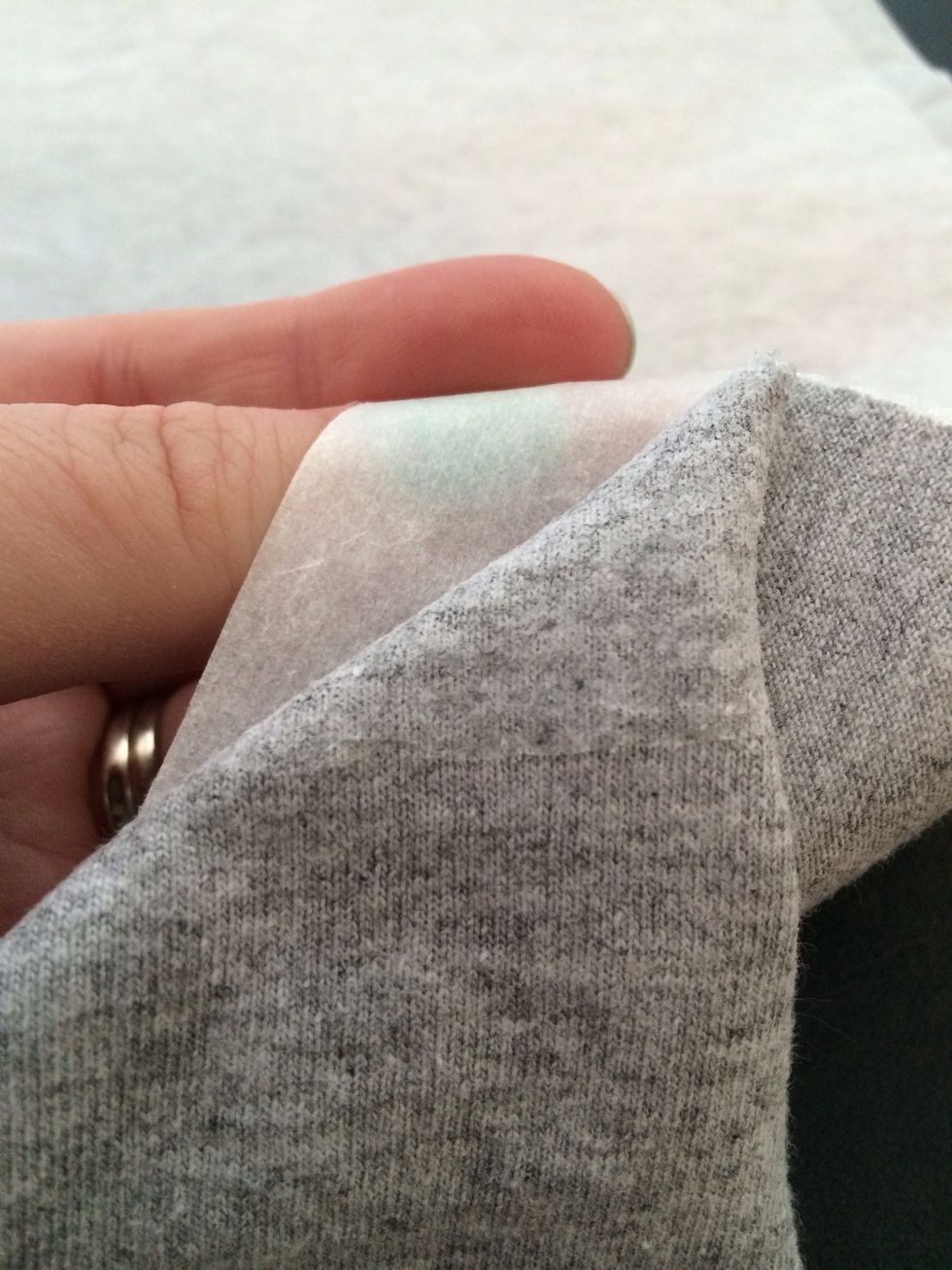 When you peel the paper backing off, the sheer adhesive will be left. If the paper won't come off just hit with an iron again, it seems to come off better when warm.