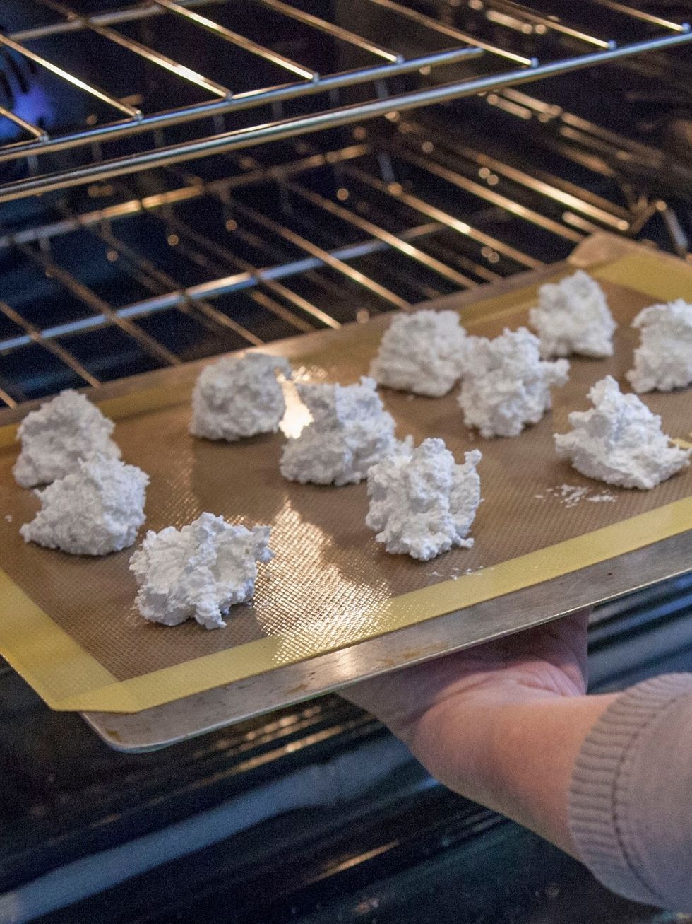 When you're about ready to bake, preheat the oven to 450 degrees. Bake the macaroons, one tray at a time for 4 minutes.