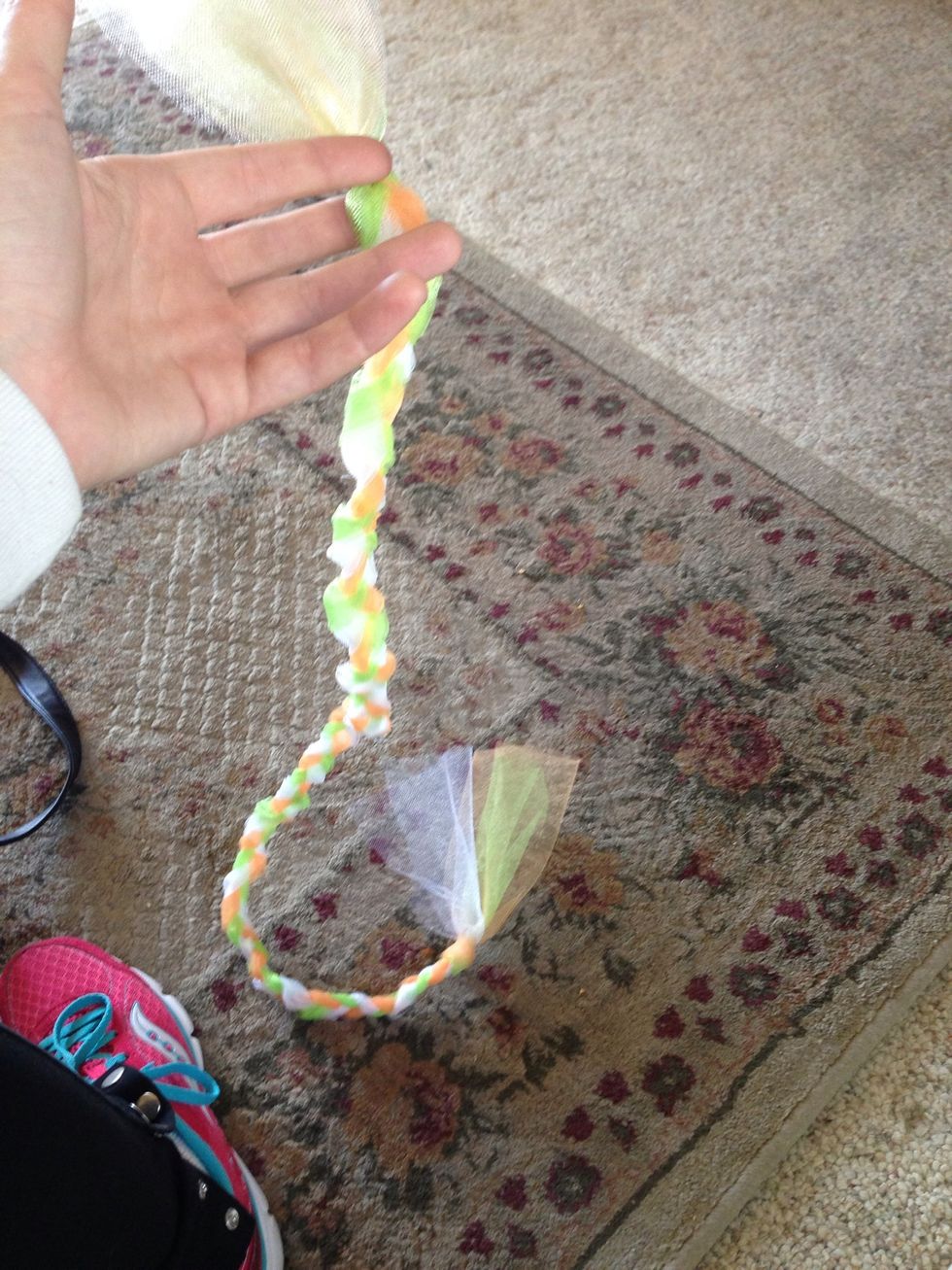 When you're close to finishing wrap it around your waist to make sure it's long enough. Then tie the other end, leaving some length.