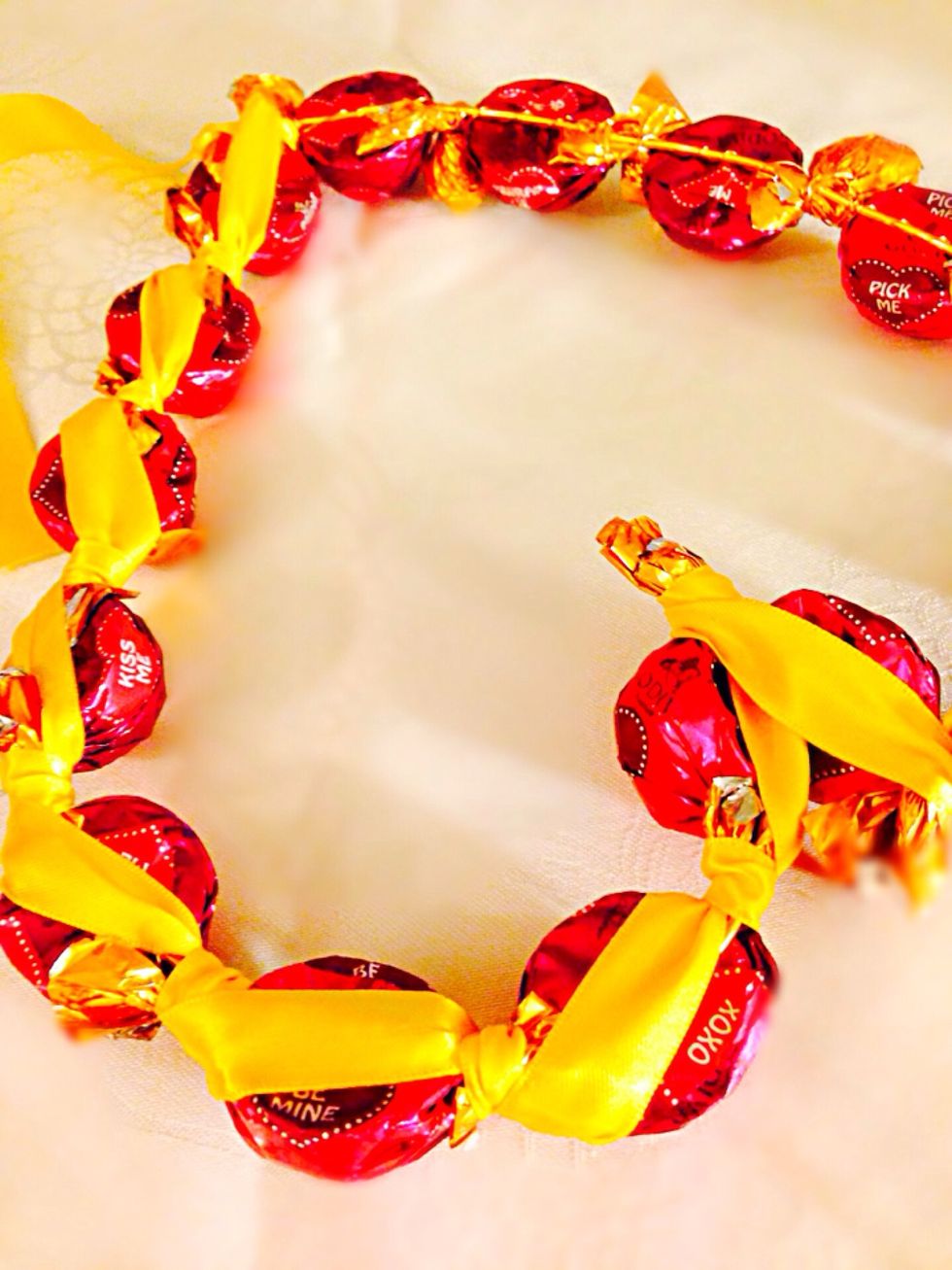 When you're done on one side take the second part of ribbon and do the same on another side