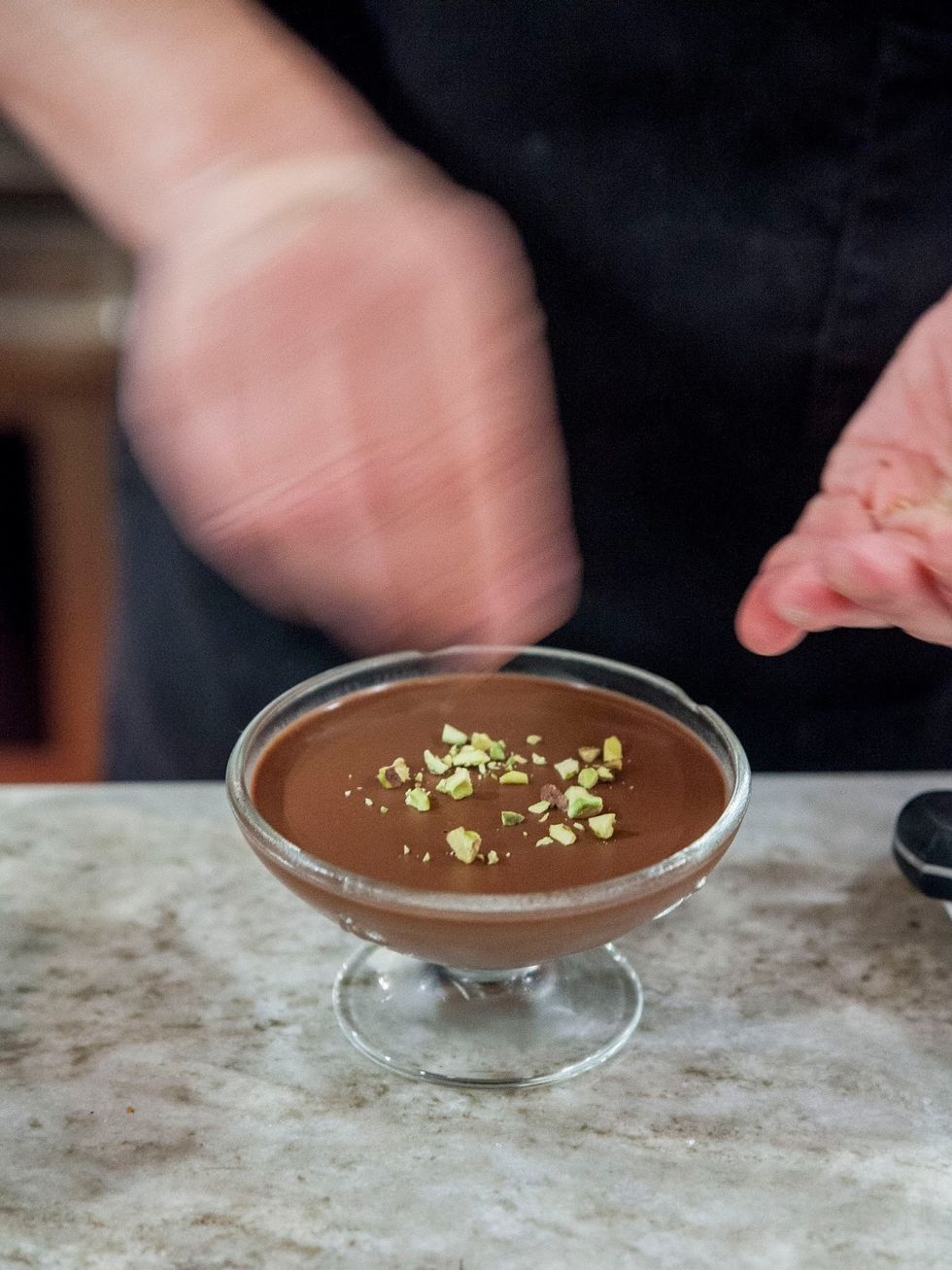 When you're ready to enjoy, chop up 3 Tbs of pistachios and sprinkle a bit on top of each mousse.Add a dab of whipped cream in the center