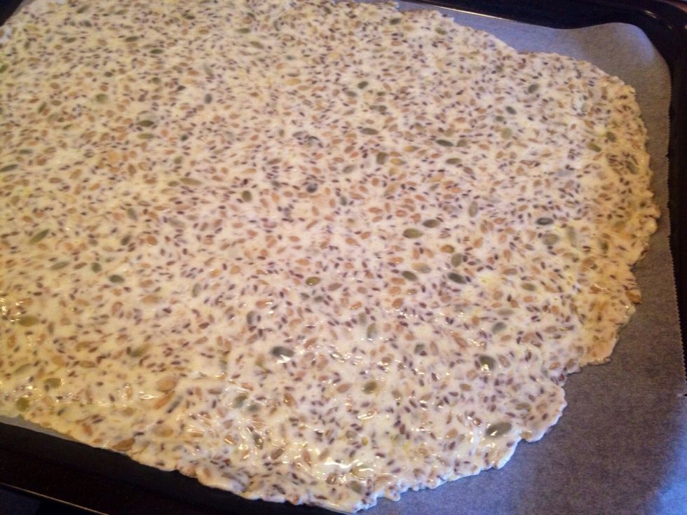 When you're satisfied with the  thickness, remove the upper parchment paper.