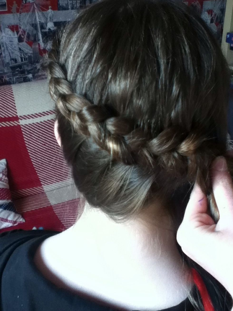 When you reach the nape of the neck, combine the braid with the hair that has been left unbraided. If that doesn't make any sense, look at the picture.