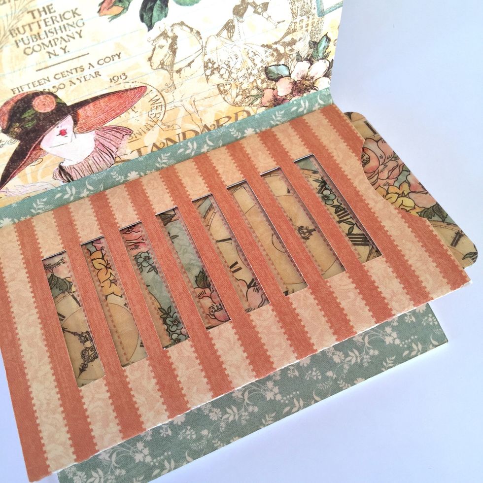 When you remove the card it shows the hidden paper or photo.