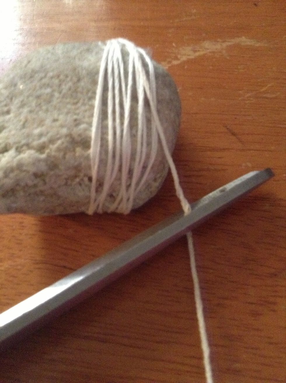 When you string as much as you want, cut the string with some left over