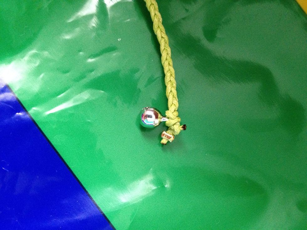 When you think you're done, slide through the bell/button and tie a knot! I burnt off the ends because it tore a little.