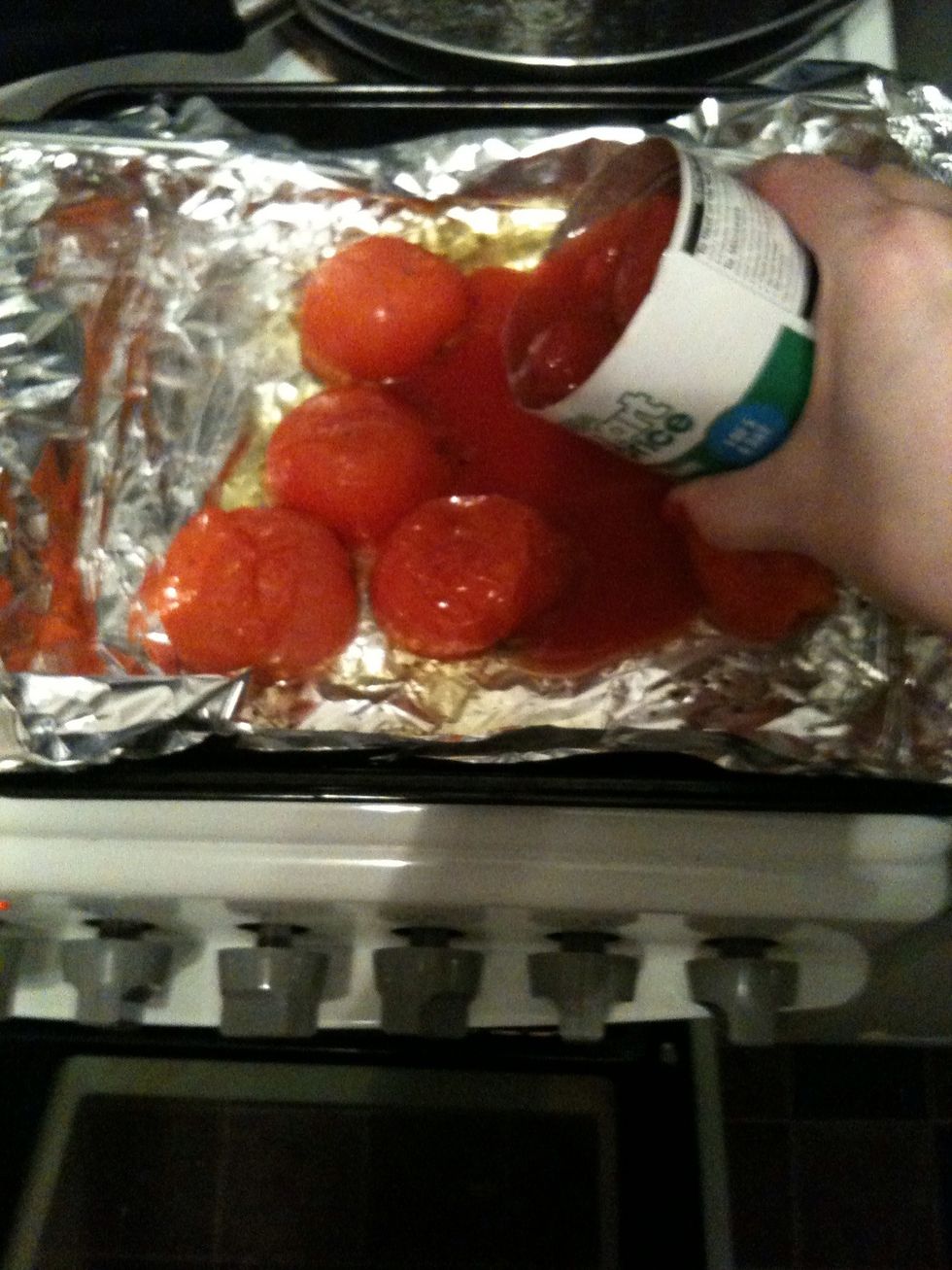 When you turn them over add a can of chopped or plum tomatoes and spread them out, stick them back in the oven.