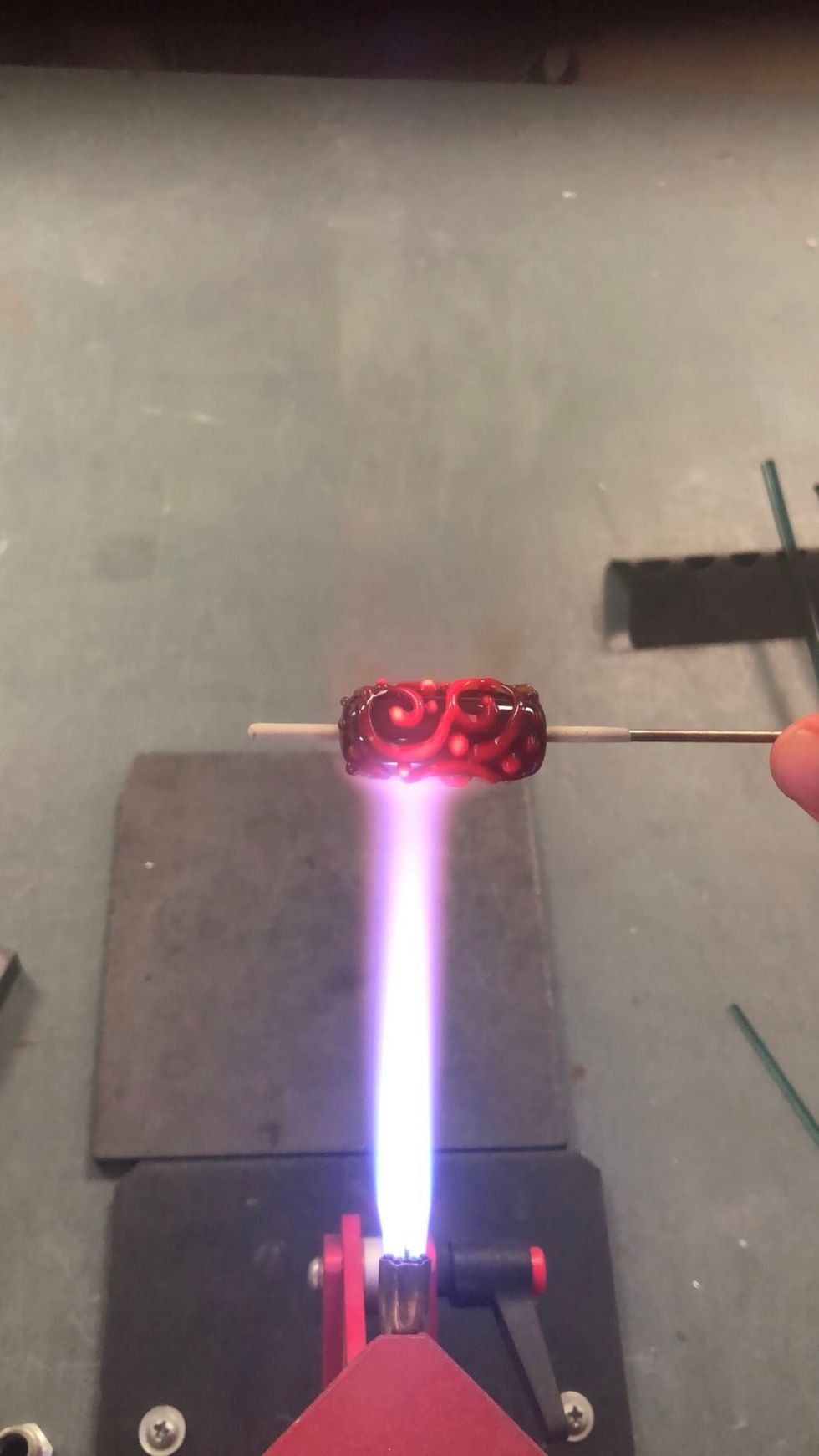 When you\u2019ve applied enough dots, give the whole bead a gentle heating again.