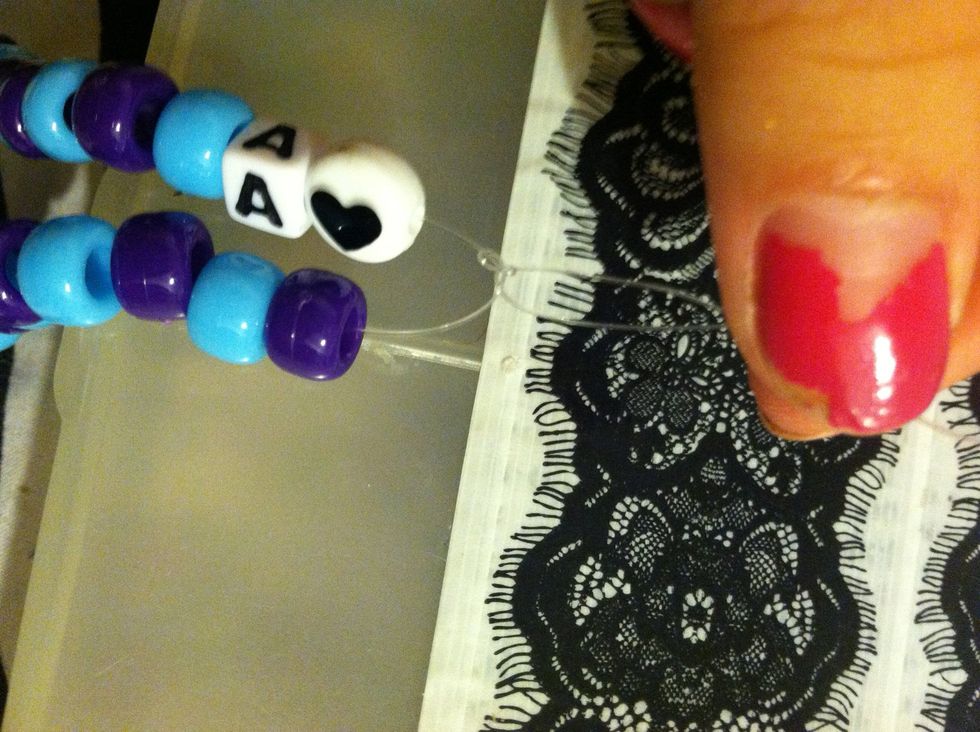 When You've Finished Stringing On your Beads Take Both Sides And Make A Few Simple Knots To Assure The Bracelet Won't Fall Apart .