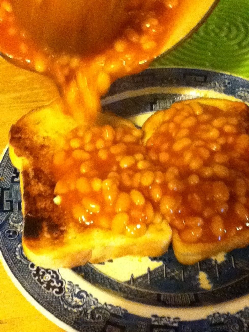 When your beans are ready, pour them on to your toast.