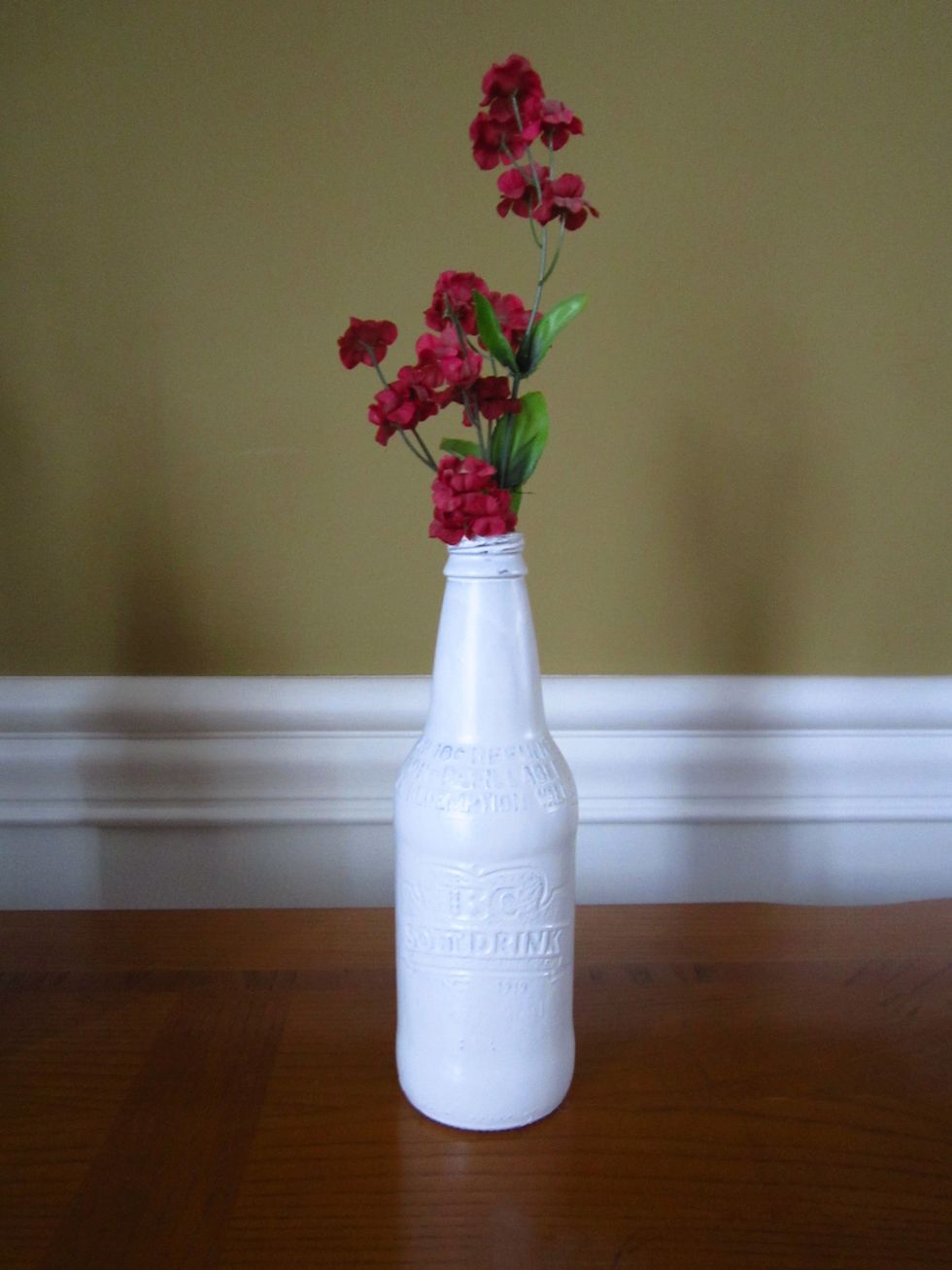 When your bottles are finally dry, find a flower to place it in. I used a fake flower piece, but any kind should work.