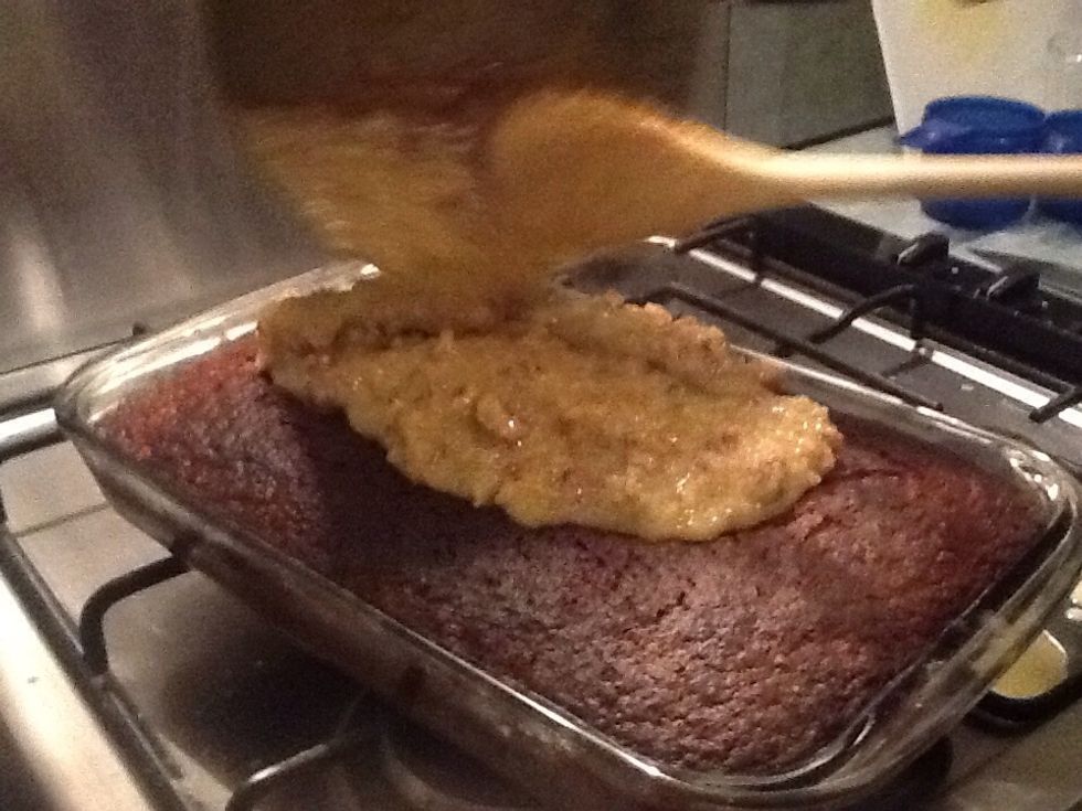 When your cake has come out of the oven, pour on topping and carefully spread while cake is still hot (use oven mitts to take cake out of oven)