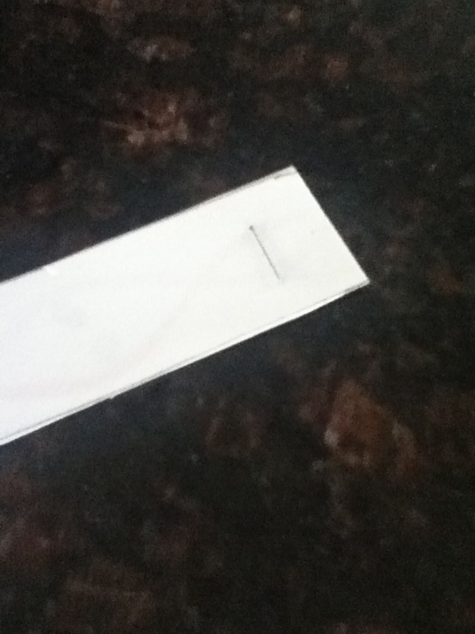 When your done cutting and putting designs on, you take two strips and staple the top o them together. If you have a design have it face inwards