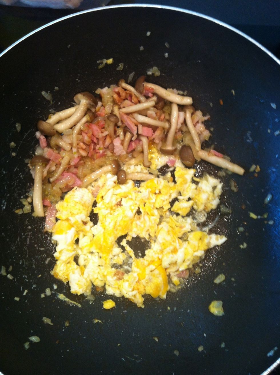 When your egg starting to cook lightly chop them you can Season with salt and pepper here watch the salt cuz bacon is already salty