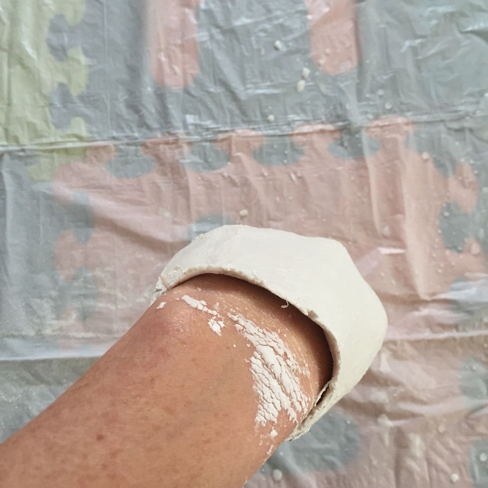 When your hand can wiggle in sculpture without disturbing its form, begin to try to separate hand from the plaster walls