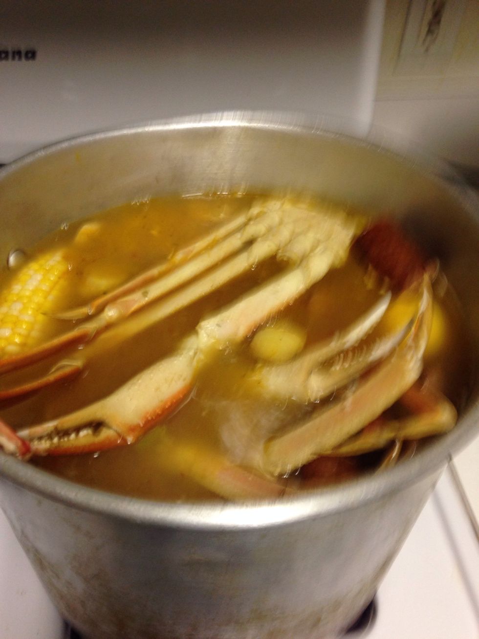 When your pot comes to a boil add your seafood and the rest of the green onions.