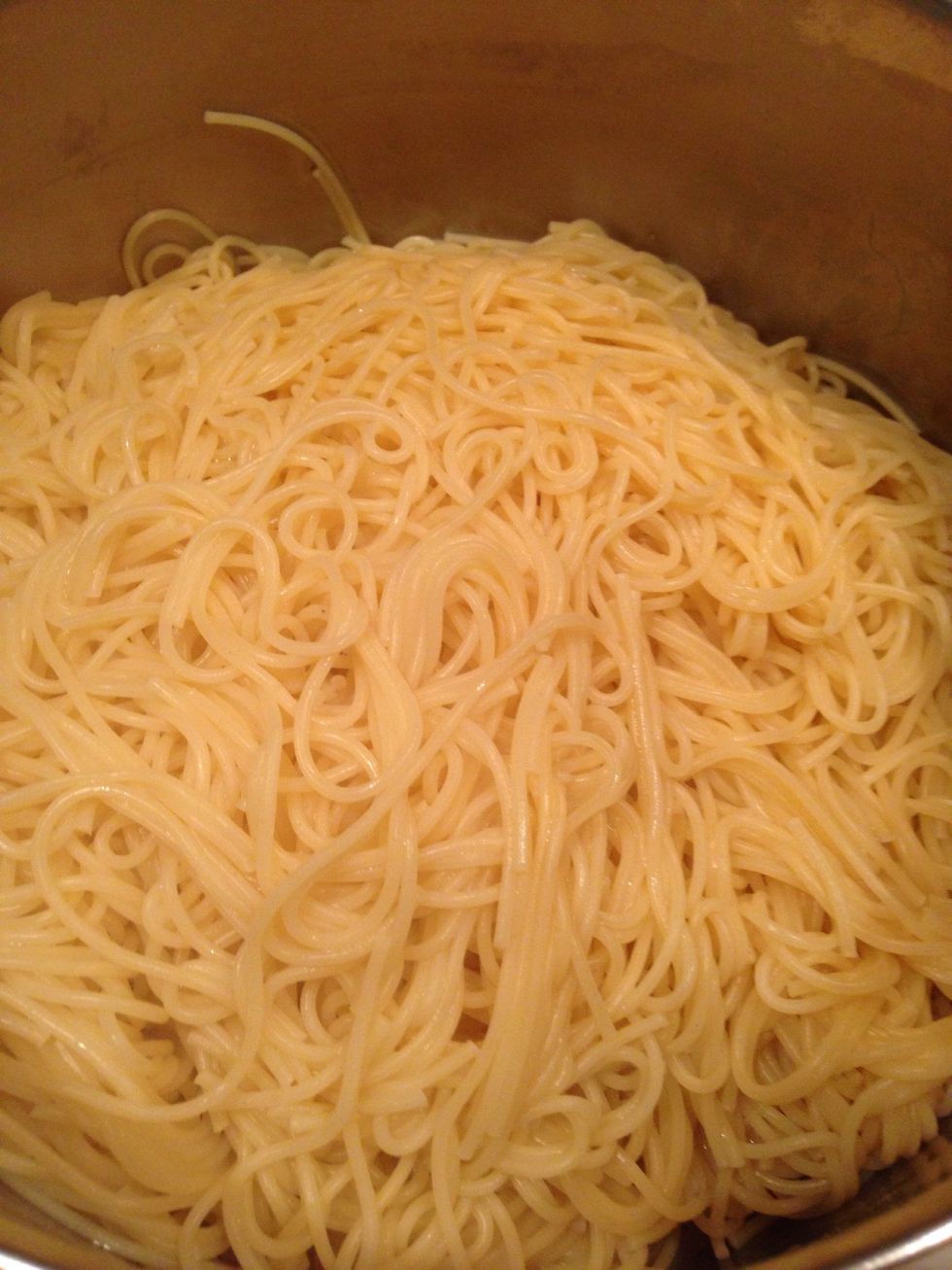 When your spaghetti noodles are al dente (or however you like them) drain and toss some on a plate.