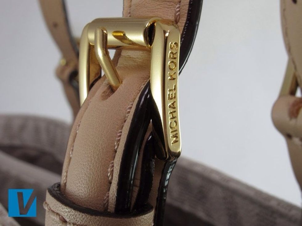 Where featured on a Michael Kors handbag, the hardware will be made of solid metal and will not flake or chip. Some pieces may be engraved, if so it will be clean with a high quality finish.