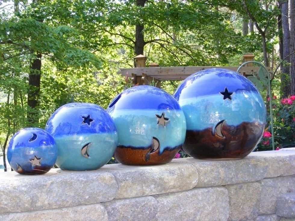 Whereas gazing balls can ward off evils, glass mushrooms will simply add the aesthetics of the garden. Gazing balls are available in a variety of colors and shape.