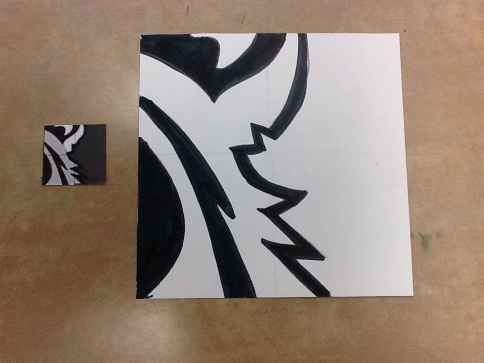 Wherever there are black areas on your small puzzle piece, color black in those shapes on the larger white paper.