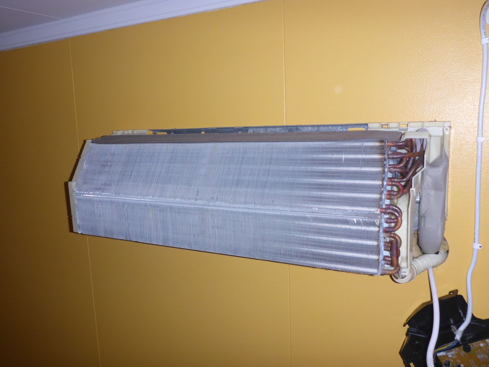 Which should leave you with the heat exchanger left on the wall, and the circuit board box hanging from the power cord.