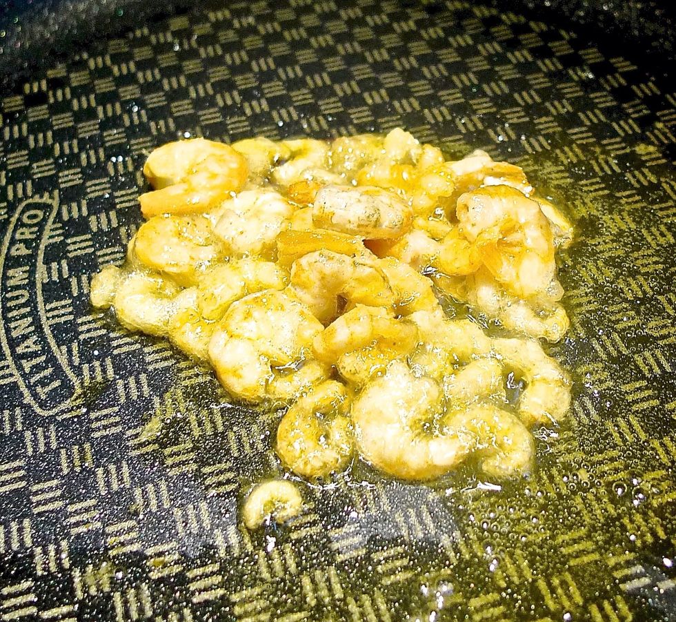 While bean curd is steaming, heat up some oil and fry dried shrimps until golden brown in colour.
