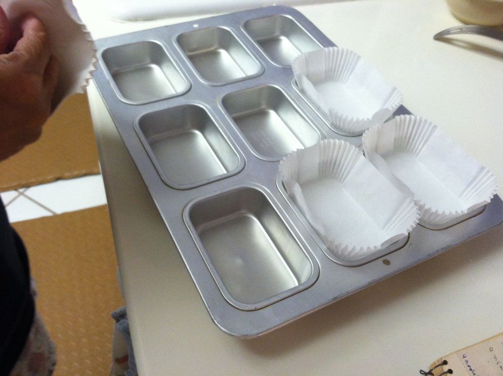 While blending, put the liners in the pan so you won't have to grease the pans.