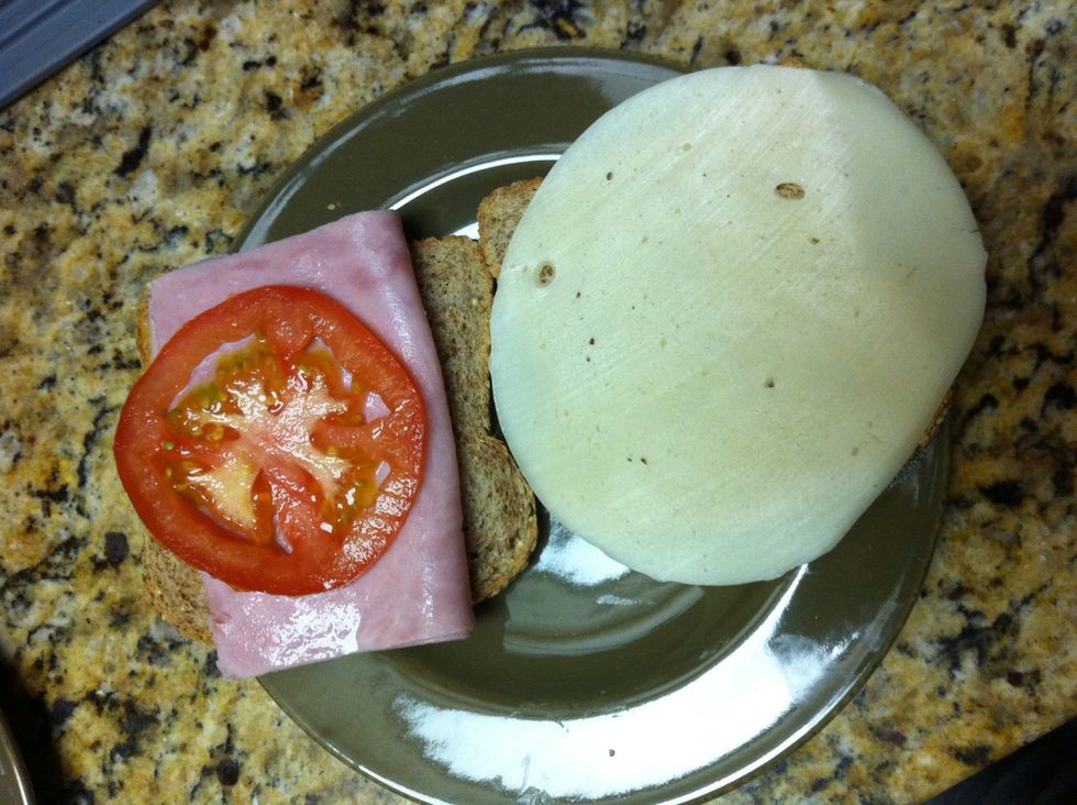 While butter melts, lay the ham/tomato slice on other piece of toast. Tip: go h.a.m first, otherwise the juicy tomato will make the bread soggy.