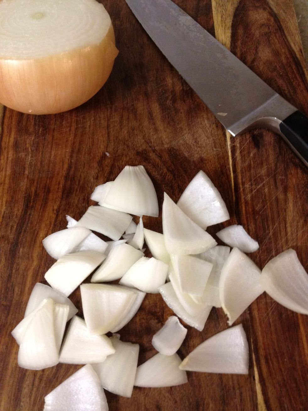 while chicken is cooking, cut up half an onion. I like to put the onion in with the garlic towards the end to keep them crisp.