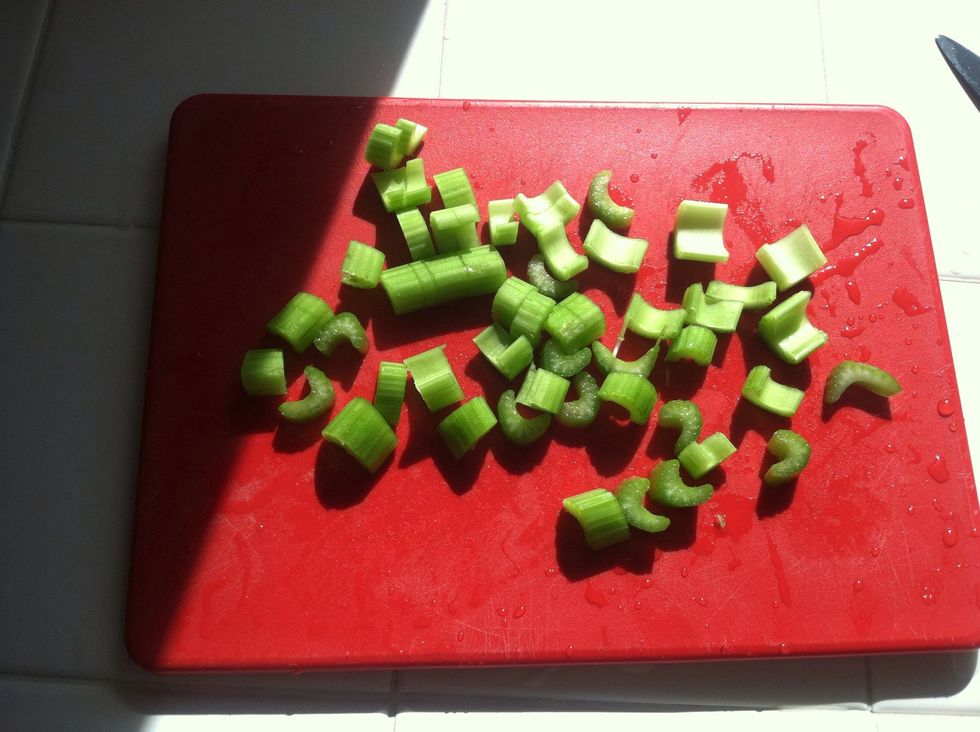 While chicken is getting happy in the sauce pan, rinse and chop 4 celery stalks