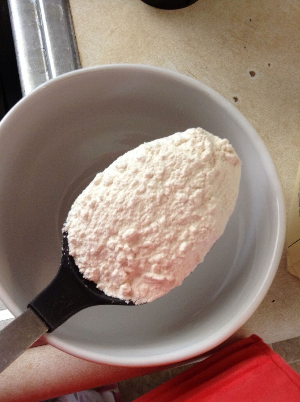 While chiles are blending, take 2spoonfuls of flour and add to bowl. Add the meats water you had cooling off. Stir with a fork, add enough water. That the mixture isn't clumpy...turn off blender.