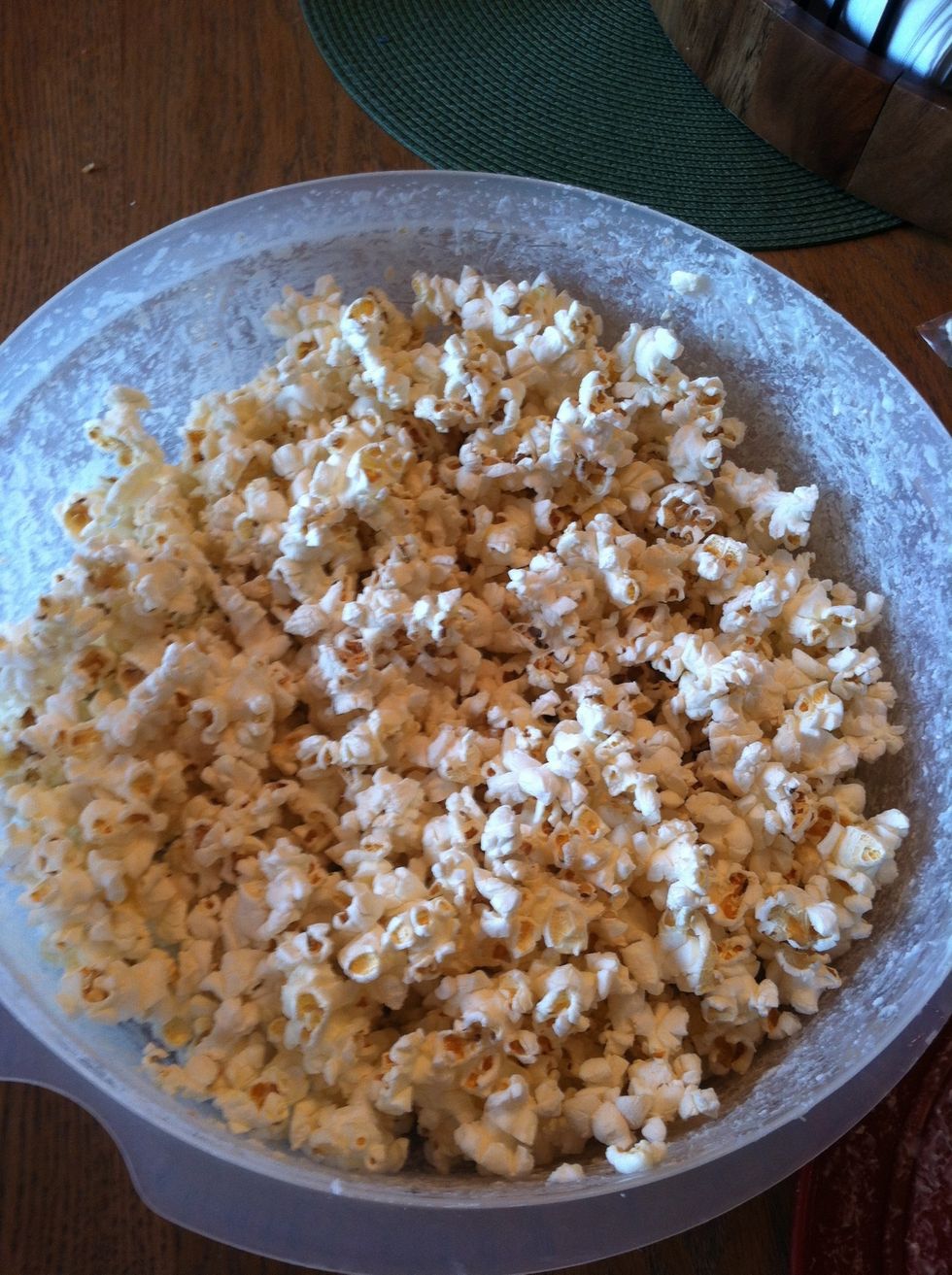 While chocolate is melting put the popcorn in the bag or container you have. Make sure it has some room for when u have to add the chocolate...you want the popcorn to be able to move to shake it