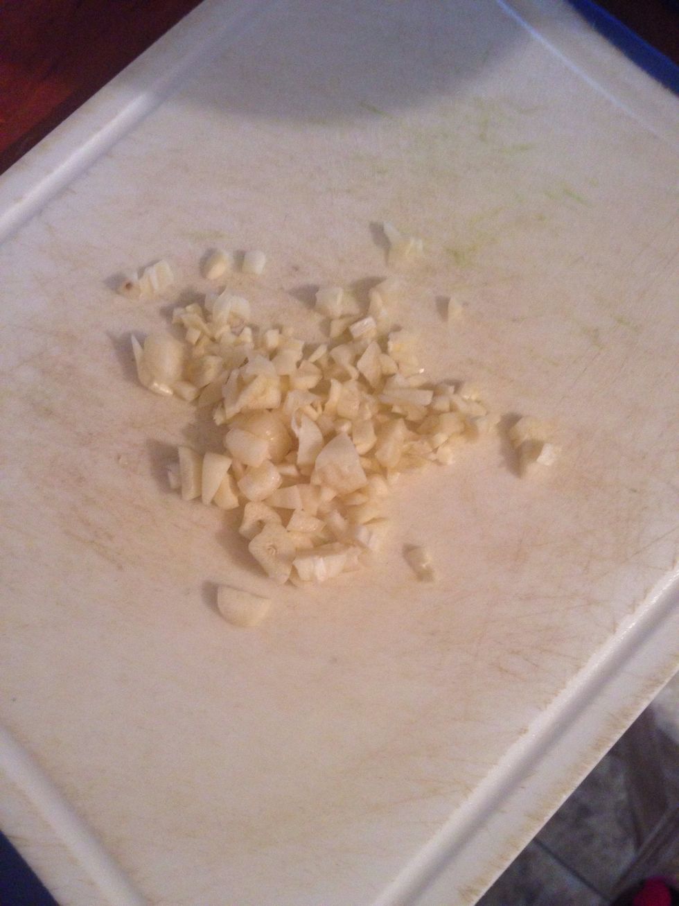 While cooking spaghetti we will make wine sauce. At first we need to chop garlic