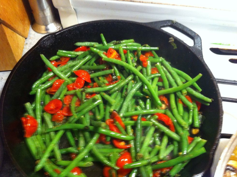 While cooking the kitchen will fill with the aromatics of the garlic and the sage... This is the time to Add your beans in and increase heat to med/high to sear the beans...