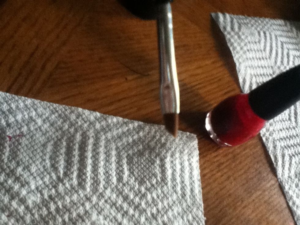 While drying, clean up around nail with a slanted brush