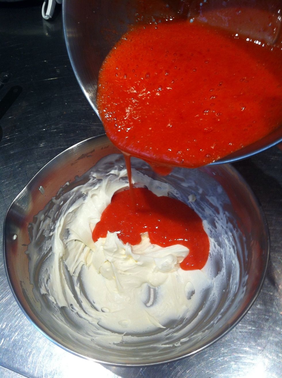 While egg whites are whisking Add 1/3 strawberries to the cream.