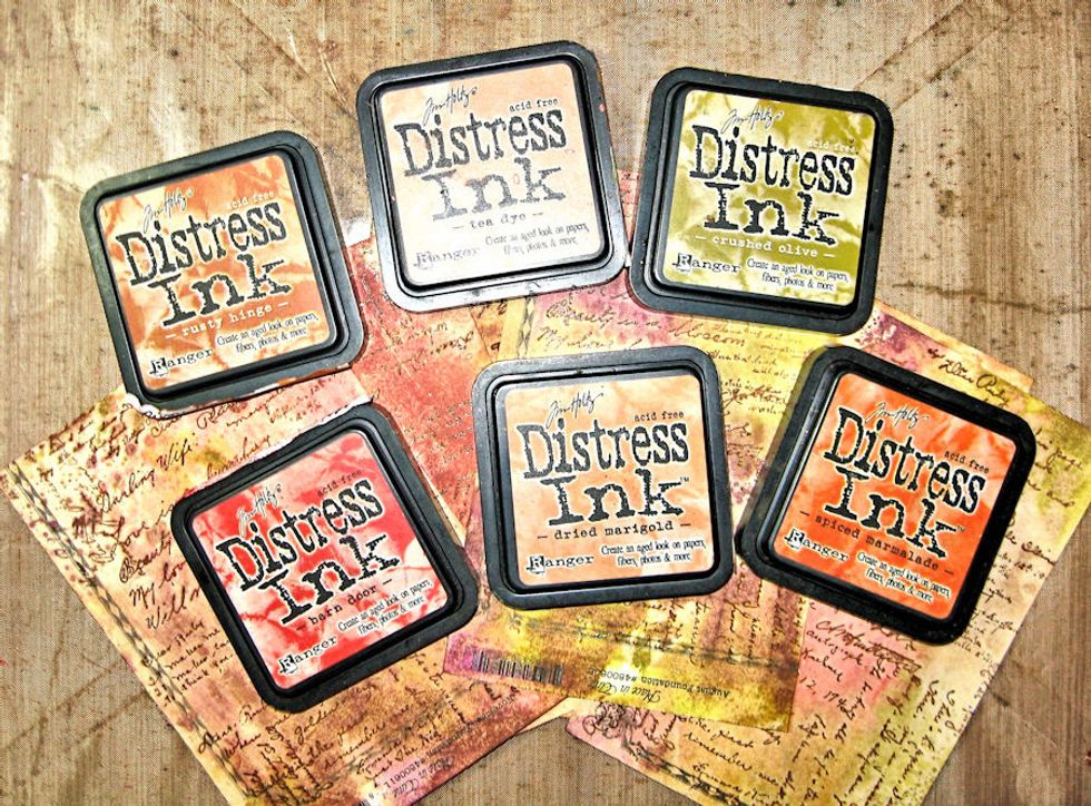 While frame is drying, make flowers. Swipe inks directly onto craft sheet. Spritz with water until beads form. Press stamped side of paper into ink puddles. Die cut with TT flower dies. Let dry.