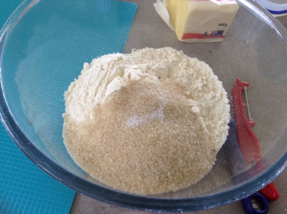 While fruit is softening make a crumble mixture by rubbing plain flour with the butter, sugar and salt