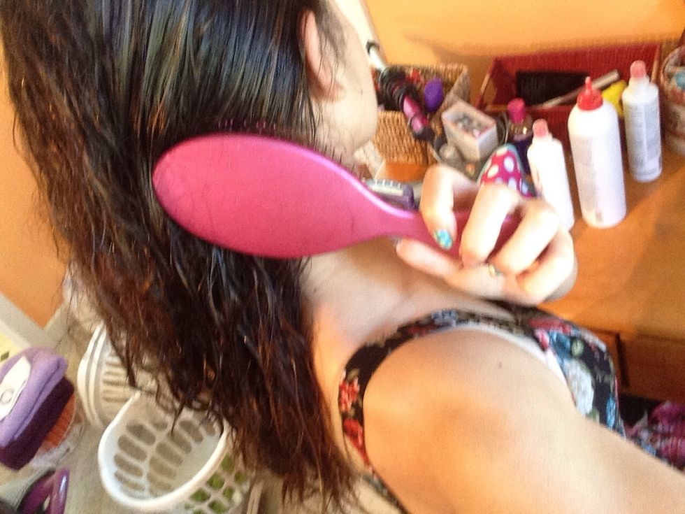 While hair is still wet, brush out all the knots and tangles with a brush. I use the Wet Brush.