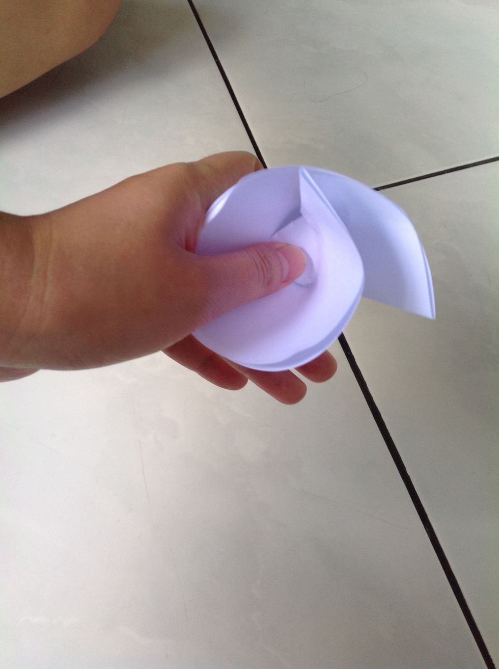 While holding the paper as above....