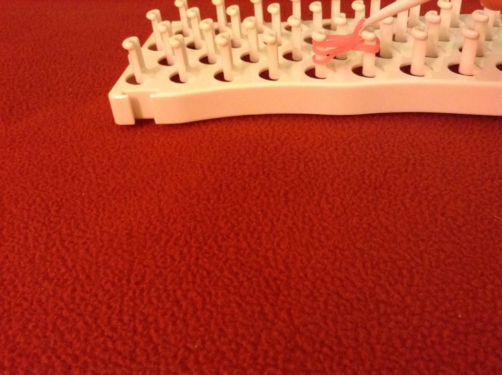 While hooked bring the band over the others and unhook it