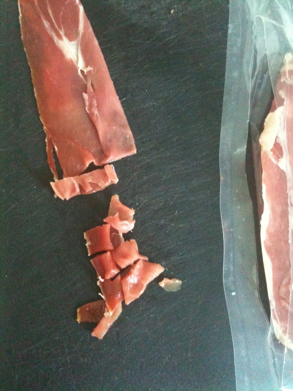 While it boils, chop the prosciutto