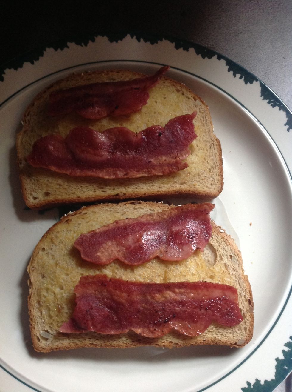 While it poaches, get your plate ready! I put my bacon on my toast, yum.