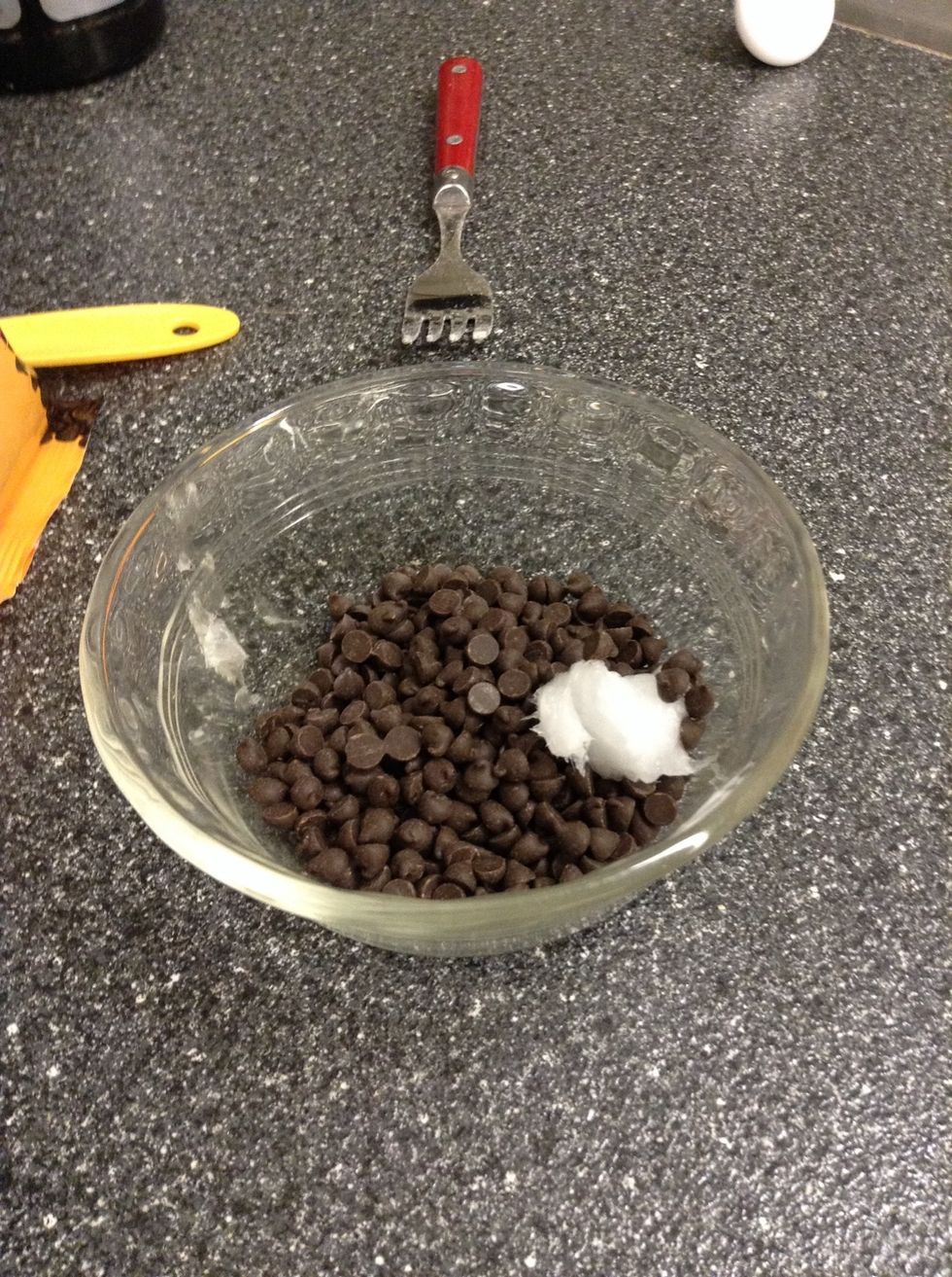 While it's baking melt the chocolate chips and coconut oil in a custard cup